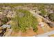 Lush aerial landscape shot of this property highlighting the mature trees surrounding this home at 2694 Hickory Valley Dr, Snellville, GA 30078