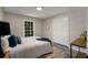 This bedroom features bright, natural light filled windows and a double door closet at 2694 Hickory Valley Dr, Snellville, GA 30078