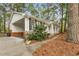 Charming single-story home with stone accents, a front porch and a connected carport at 2694 Hickory Valley Dr, Snellville, GA 30078