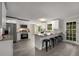 Modern kitchen boasts stainless steel appliances and a breakfast bar with seating for four at 2694 Hickory Valley Dr, Snellville, GA 30078