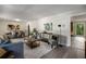 Bright living room with hardwood floors, neutral decor, and an open layout at 2694 Hickory Valley Dr, Snellville, GA 30078