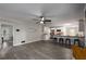 Open-concept living area connected to a kitchen with stainless steel appliances and a breakfast bar at 2694 Hickory Valley Dr, Snellville, GA 30078