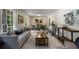 Spacious living room boasts lots of natural light, neutral paint, and wood-look floors at 2694 Hickory Valley Dr, Snellville, GA 30078