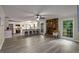 Bright living room features a stone fireplace and connects to a modern kitchen with a breakfast bar at 2694 Hickory Valley Dr, Snellville, GA 30078