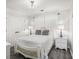 Comfortable bedroom with stylish decor, lamps on nightstands, and soft, neutral tones at 3055 Dogwood Hollow Ln, Lawrenceville, GA 30043