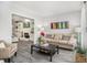 Cozy living room with a fireplace, built-in bookshelves, and comfortable seating on stylish gray floors at 3055 Dogwood Hollow Ln, Lawrenceville, GA 30043