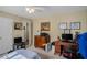 Bedroom with a built in desk and multiple prints and portraits on the wall at 3264 Salem Cove Se Trl, Conyers, GA 30013