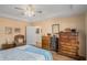 Cozy bedroom with a ceiling fan and decorative dressers at 3264 Salem Cove Se Trl, Conyers, GA 30013