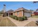 Brick home with a well-manicured landscape, attached garage and a welcoming walkway, showcasing its inviting curb appeal at 3264 Salem Cove Se Trl, Conyers, GA 30013