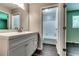 Bathroom with single vanity, new fixtures, and tub/shower combo at 4342 Riverwood Cir, Decatur, GA 30035
