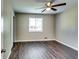 Bedroom with new floors, neutral paint, window, and ceiling fan at 4342 Riverwood Cir, Decatur, GA 30035