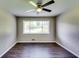 Bedroom with window, neutral paint, and ceiling fan at 4342 Riverwood Cir, Decatur, GA 30035
