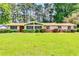 Charming ranch-style home with manicured lawn and mature trees at 4342 Riverwood Cir, Decatur, GA 30035