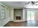 Cozy living room with a stunning stone fireplace and built-in shelving at 4342 Riverwood Cir, Decatur, GA 30035