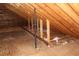 Exposed wood frame attic featuring unfinished flooring, wooden beams, and insulation at 5225 Kings Hwy, Douglasville, GA 30135
