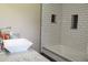 Bright bathroom showcasing a vessel sink, granite counters and subway tile at 5225 Kings Hwy, Douglasville, GA 30135