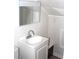 Small bathroom features a white vanity with a mirrored cabinet at 5225 Kings Hwy, Douglasville, GA 30135