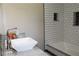 Bathroom showcasing a modern vanity sink, granite countertop, and stylish subway tile in shower and backsplash at 5225 Kings Hwy, Douglasville, GA 30135