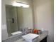 Bathroom with sleek vanity, vessel sink, granite counters, subway tile and large mirror at 5225 Kings Hwy, Douglasville, GA 30135