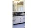 Bathroom featuring black tiled countertops and sink at 5225 Kings Hwy, Douglasville, GA 30135
