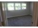Sunlit bedroom featuring a window and neutral carpeting at 5225 Kings Hwy, Douglasville, GA 30135