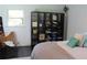 Light-filled bedroom with a modern storage unit, and a comfortable bed with stylish pillows at 5225 Kings Hwy, Douglasville, GA 30135