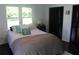 Bedroom with dark wood floors, ample natural light, and a closet at 5225 Kings Hwy, Douglasville, GA 30135