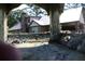View of a brick house with a metal roof and a covered porch, seen through the decorative frame at 5225 Kings Hwy, Douglasville, GA 30135