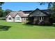 Beautiful two-story home with a manicured lawn, complemented by a sturdy metal roof for added value at 5225 Kings Hwy, Douglasville, GA 30135