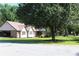 Attractive home with a neat lawn, carport, and a reliable metal roof ensures comfort and protection at 5225 Kings Hwy, Douglasville, GA 30135