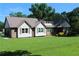 Charming home featuring a well-maintained lawn and a durable metal roof for long-lasting protection at 5225 Kings Hwy, Douglasville, GA 30135