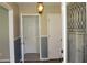Hallway showing multiple doors and a stylish glass-accented door, enhancing the home's charm at 5225 Kings Hwy, Douglasville, GA 30135