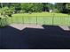 Outdoor patio featuring decorative metal railing overlooking a lush green lawn at 5225 Kings Hwy, Douglasville, GA 30135
