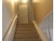 Carpeted staircase with white railings leading to the second floor at 5225 Kings Hwy, Douglasville, GA 30135