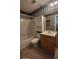 Cozy bathroom featuring a tub, vanity, toilet, and shelving unit for storage at 3219 Roundfield Cir, Duluth, GA 30096
