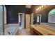 A bathroom features wallpaper, a double vanity, and separate tub and shower at 3219 Roundfield Cir, Duluth, GA 30096