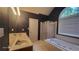 Bathroom with a double vanity, separate tub and shower, and dark wallpaper at 3219 Roundfield Cir, Duluth, GA 30096