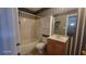 Bathroom showcasing a tub, vanity, toilet, and functional shelving unit at 3219 Roundfield Cir, Duluth, GA 30096