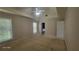 A carpeted bedroom features natural lighting and a ceiling fan for added comfort at 3219 Roundfield Cir, Duluth, GA 30096