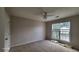 Bedroom with carpet, a ceiling fan, and natural light, creating a cozy atmosphere at 3219 Roundfield Cir, Duluth, GA 30096