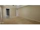 A bedroom showcases neutral walls and doors leading to the ensuite and hallway at 3219 Roundfield Cir, Duluth, GA 30096