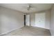 Bedroom with a ceiling fan, carpet, and closet for ample storage space at 3219 Roundfield Cir, Duluth, GA 30096