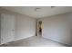 This bedroom features neutral carpet and paint with an en-suite bathroom at 3219 Roundfield Cir, Duluth, GA 30096