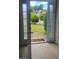 View from entryway to front yard, visible through glass-paned front doors at 3219 Roundfield Cir, Duluth, GA 30096