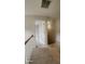 Hallway with carpet, railing, and doors leading to other rooms at 3219 Roundfield Cir, Duluth, GA 30096