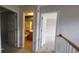 Upstairs hallway view of a bathroom and bedroom at 3219 Roundfield Cir, Duluth, GA 30096
