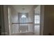 Upstairs hallway featuring a railing and window with natural light at 3219 Roundfield Cir, Duluth, GA 30096