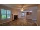 Bright living room with a cozy fireplace and large windows offering natural light at 3219 Roundfield Cir, Duluth, GA 30096