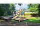 Community playground with slides and swings provides a fun outdoor space for children at 3219 Roundfield Cir, Duluth, GA 30096