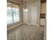Bright dining area with a chandelier, neutral paint, and large windows at 5035 Harbor Ridge Dr, Buford, GA 30518